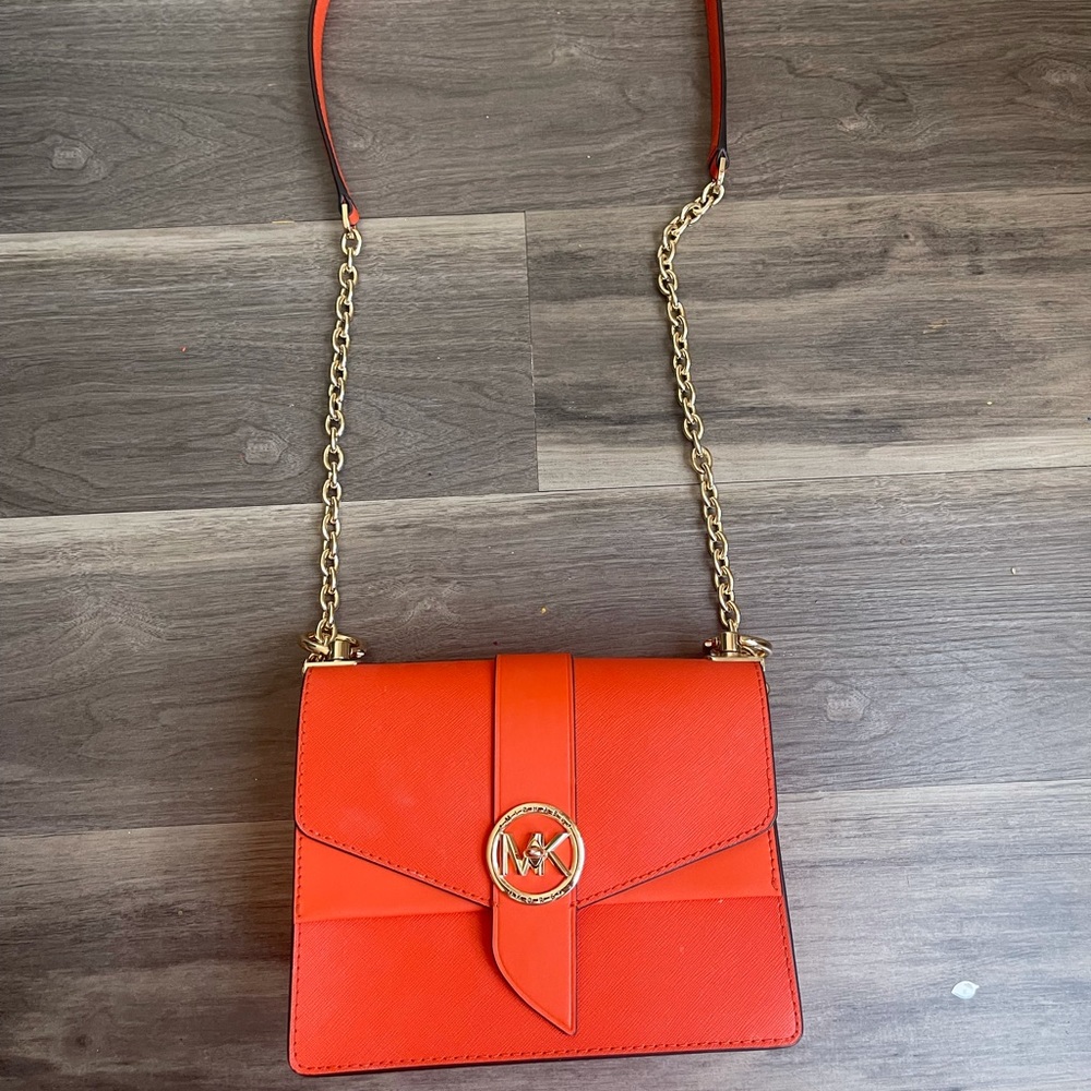 Michael Kors Bag. It’s collection of last year. Orange color.